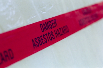 Asbestos tape accross plastic containment area.